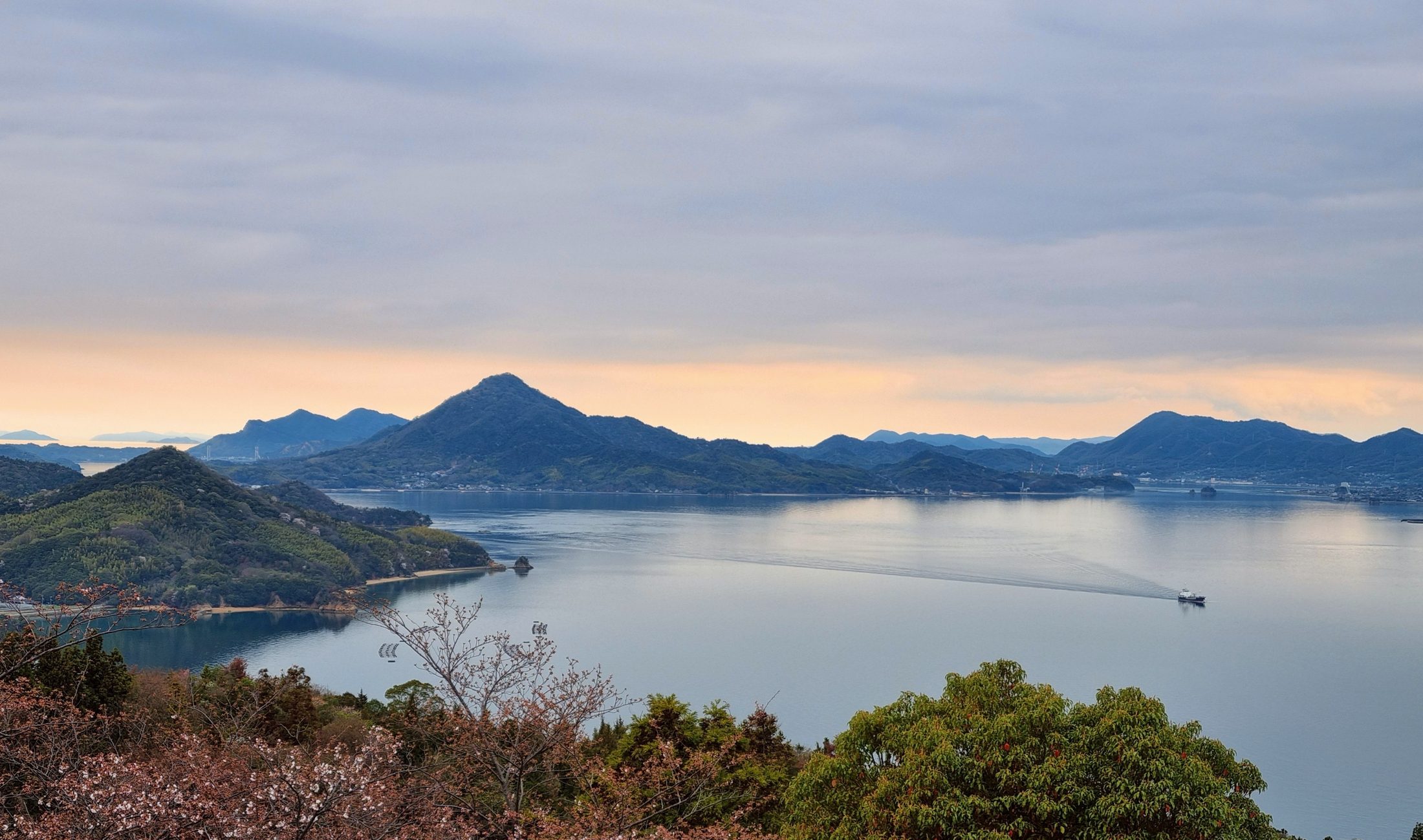 Calm inland sea with islands at dusk